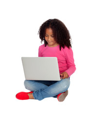 Naklejka premium African little girl with a laptop