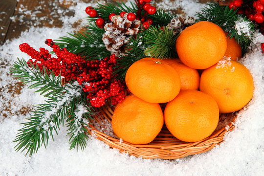 Christmas composition with ripe tangerines close up