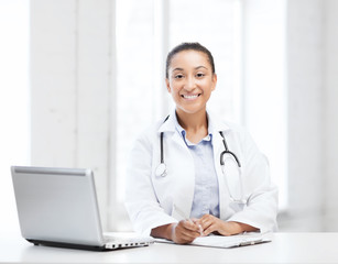 Fototapeta na wymiar female doctor with laptop pc