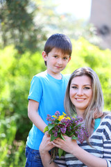 Happy mom and son in the park