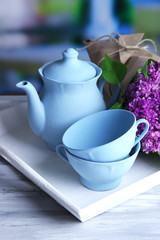 Composition with tea set and bouquet of beautiful spring