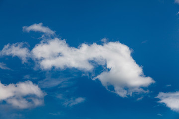 Fototapeta na wymiar Set of white clouds over blue