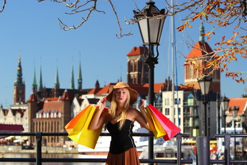 Stylish shopper woman in old town Gdansk
