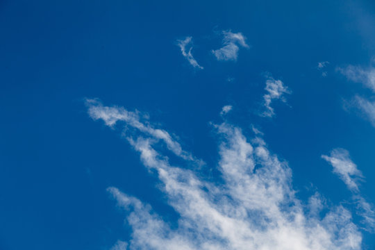 Set of white clouds over blue