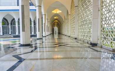 Shining floor marble reflection at mosque corridor