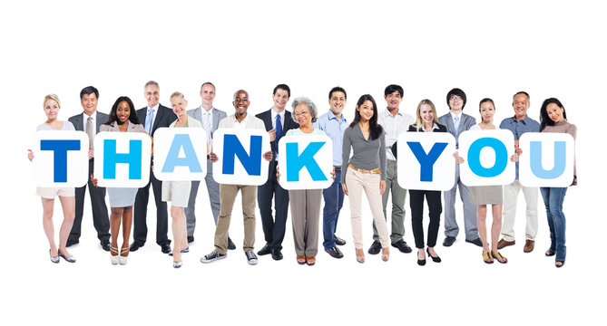 Group Of Business People Holding Word Thank You