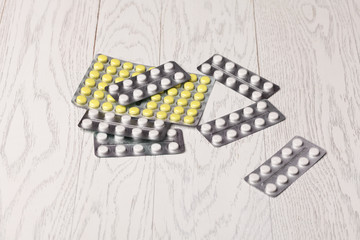 Pills in blister pack on table