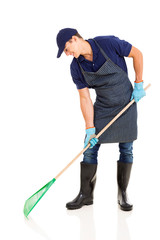 gardener raking on white background