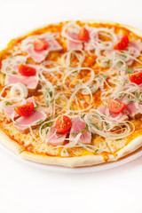 pizza with tuna, onion rings and cherry