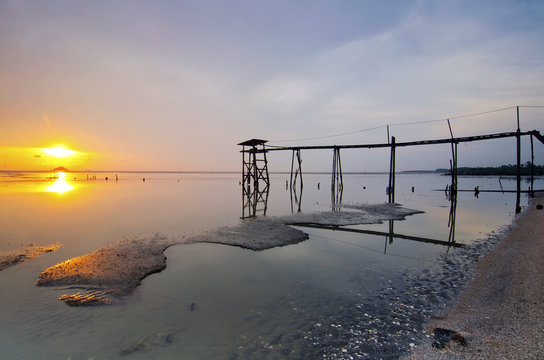 old bridge at jeram beach during sunset