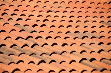 Old red tiles roof background