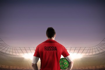 Russia football player holding ball