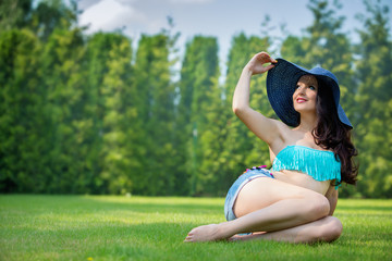 Sexy woman relaxing in garden