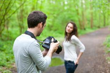 Photographer taking picture of an attractive model