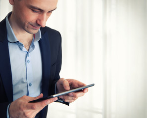 Businessman using his tablet computer