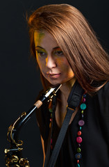 Fototapeta na wymiar woman with saxophone