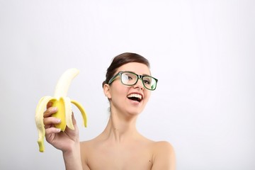 woman with nerd glasses and banana