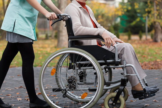 Lady on wheelchair and nurse