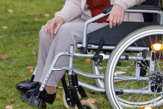 Disabled person on wheelchair outdoors