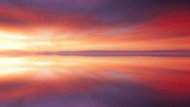 Reflection of colorful sunset clouds with long exposure effect