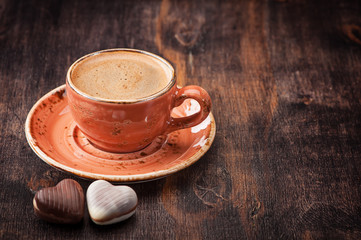 Espresso with chocolate candies. Cup of coffee