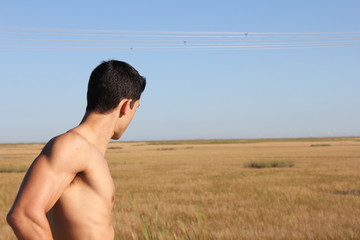 Muscular young male bodybuilder shirtless