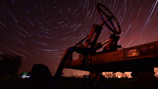 Circles of time - timelapse with night startails and old traktor