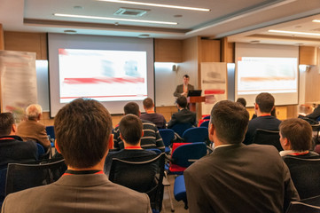 people sitting rear at the business conference