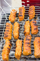 Barbecue with ground meat rolls