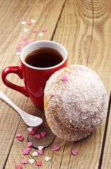 Obraz na płótnie Canvas Delicious bun and cup of tea