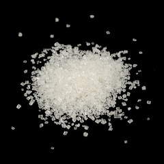 Obraz na płótnie Canvas Pile of White Sugar on Black Background