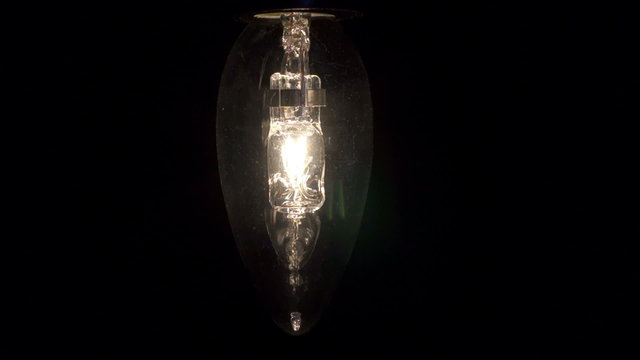 Halogen lamp. Real light bulb flickering.