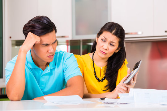 Asian Couple Fighting Unpaid Bills