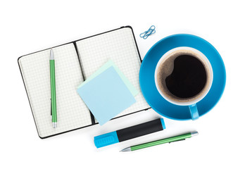 Blue coffee cup and office supplies