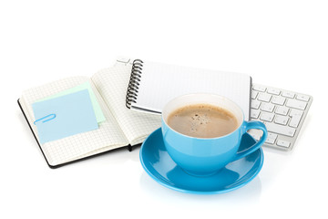 Blue coffee cup and office supplies