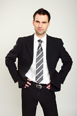 Portrait of handsome businessman in suit standing