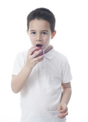 Child eats an apple.