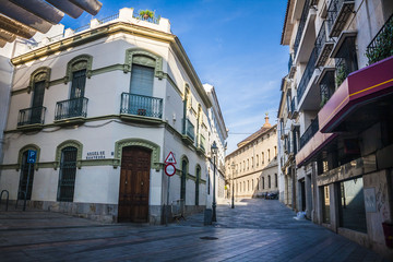 Naklejka na ściany i meble Typical cobbled mediterranean street of white houses in Cordoba