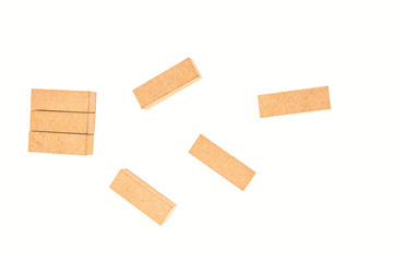 jenga tower colapsing on white background