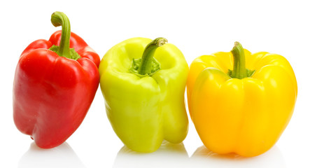 fresh yellow, red and green bell peppers isolated on white