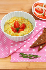 Bowl of tasty fresh hummus, close up
