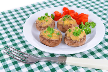 Stuffed mushrooms on plate on table close-up