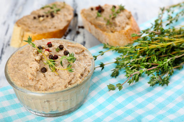 Fresh pate with bread on wooden table