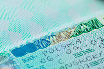 Fototapeta na wymiar Paszportu stempel wizy Polski na tle koncepcji podróży