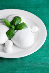 Tasty mozzarella cheese with basil