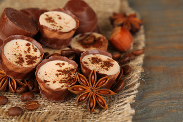 Tasty chocolate candies with coffee beans and nuts