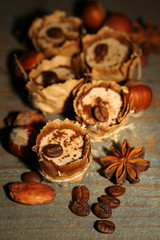 Tasty chocolate candies with coffee beans and nuts