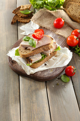 Delicious sandwiches with meet on table close-up
