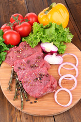 Raw beef meat with vegetables
