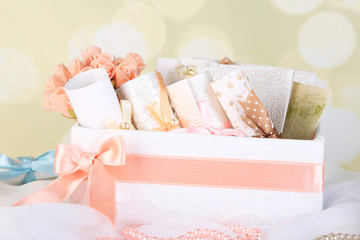 Beautiful handmade wedding cards in box, on light background